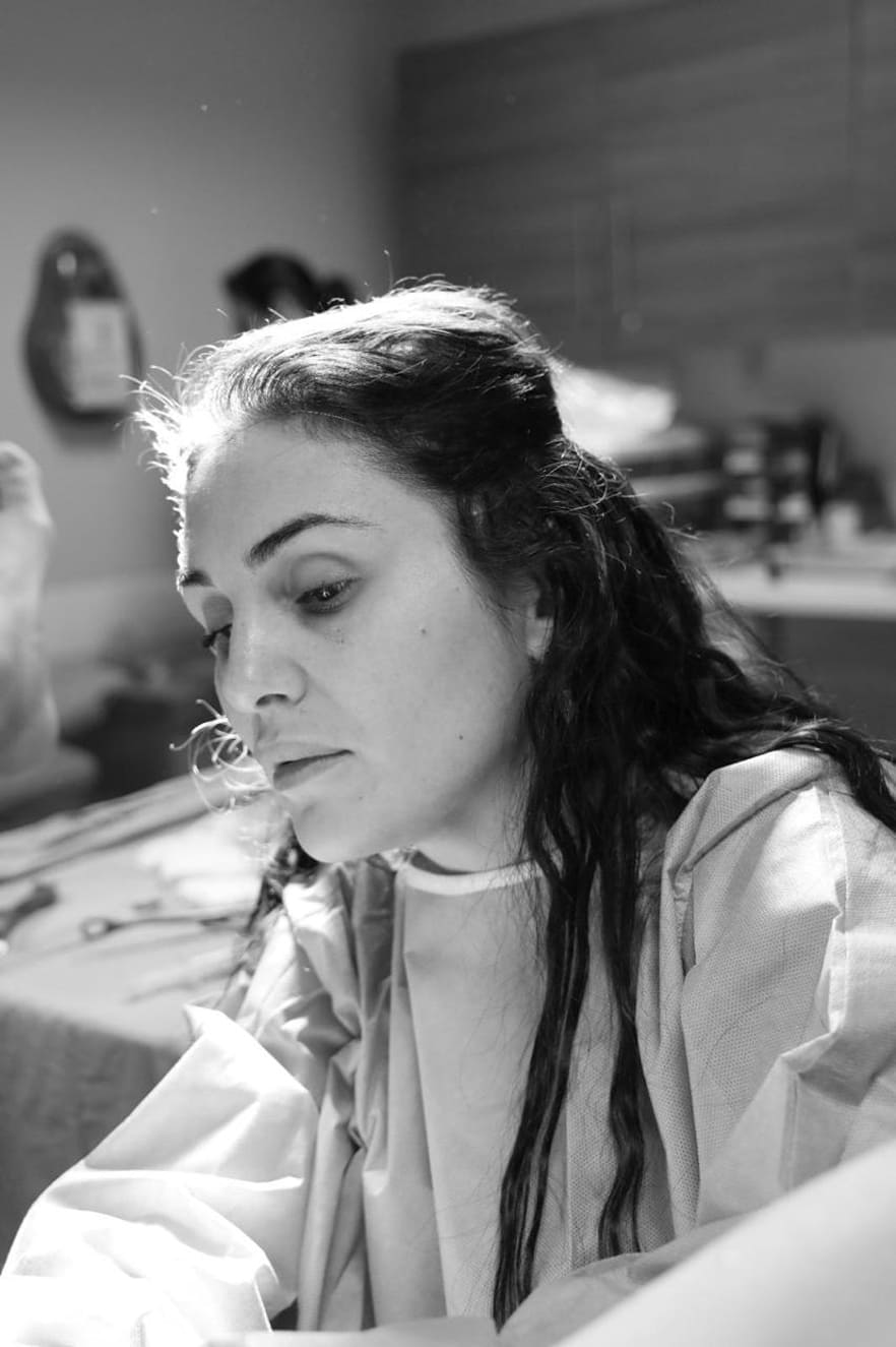 Female gynecologist taking selfie inside clinic